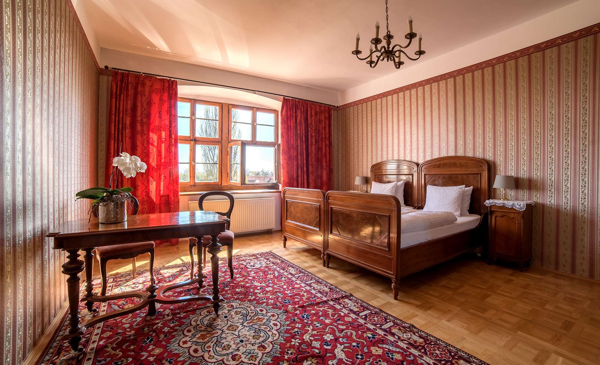 Red Room: two antique beds, red curtains and a rug