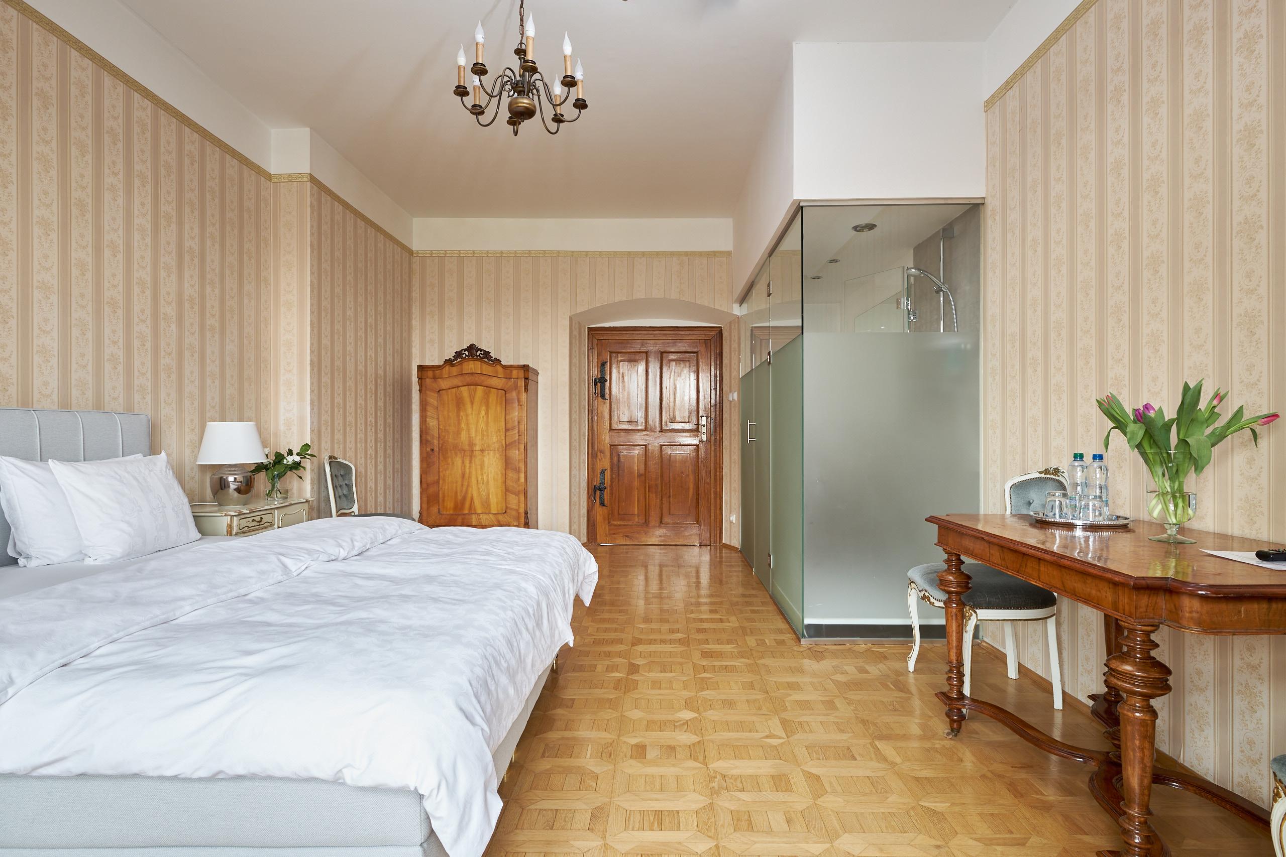 White Room: bright interior with a double bed and glass-walled bathroom